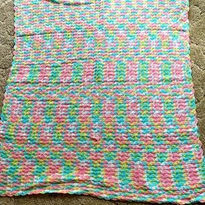 Multi colored, light, hand crocheted baby blanket